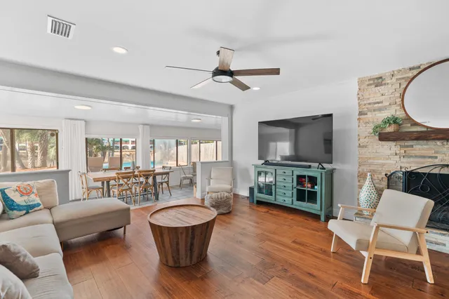 a view of a dining room with furniture and chandelier