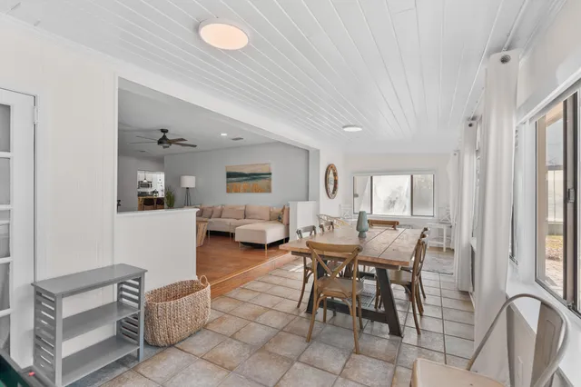 a kitchen with stainless steel appliances granite countertop a sink a stove and cabinets