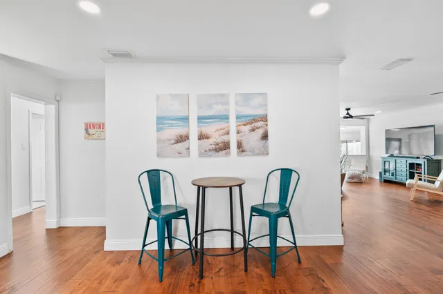 a large kitchen with stainless steel appliances granite countertop a stove and a sink