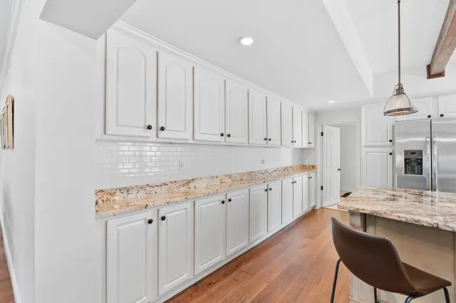 a room that has a bed and a mirror