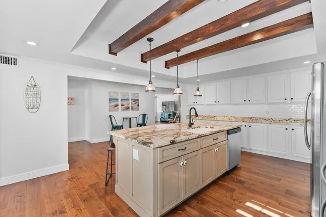 a bathroom with a toilet sink and shower