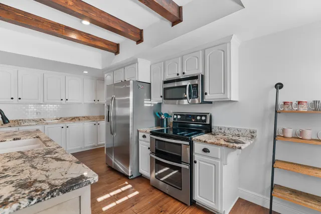 a bedroom with furniture and a window
