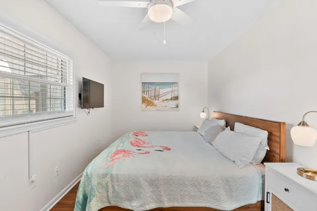 a view of a swimming pool with outdoor seating and plants