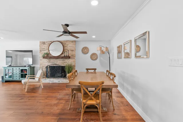 a dining room with furniture and window