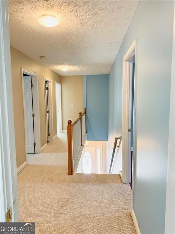 543 Saddle Ridge Drive Bethlehem, GA 30620 - Photo 18 of 36 a view of a livingroom with a wardrobe space