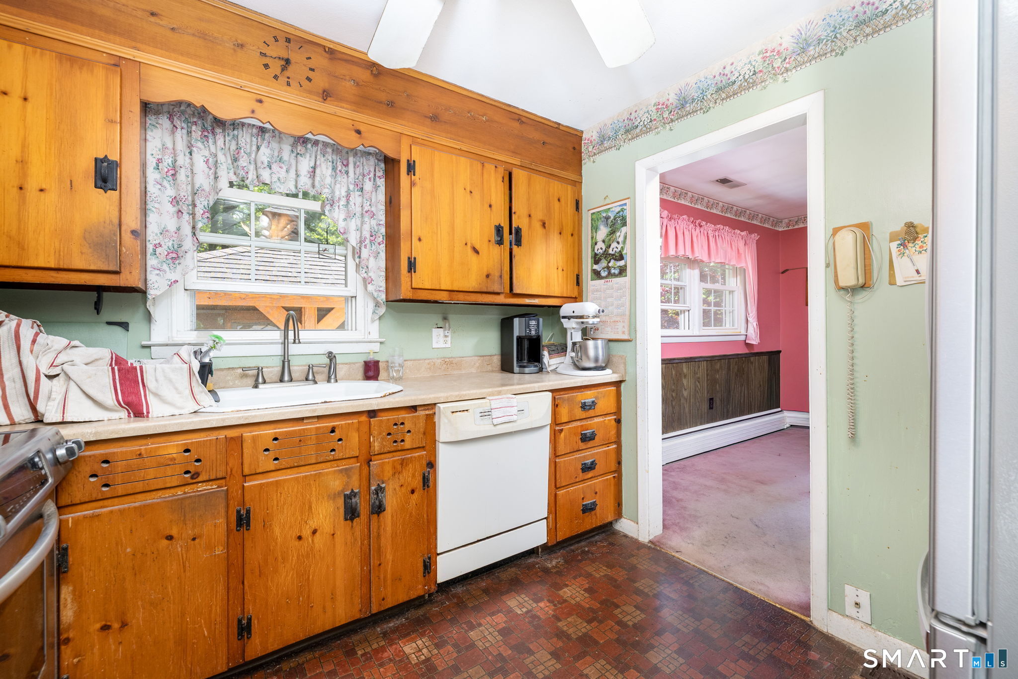 189 Bee Street Meriden, CT 06450 - Photo 11 of 39 a kitchen with stainless steel appliances granite countertop a stove a sink and a microwave