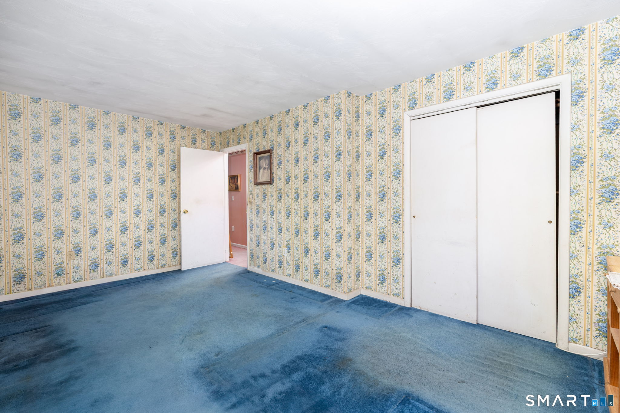 189 Bee Street Meriden, CT 06450 - Photo 14 of 39 a view of an empty room with closet and entryway