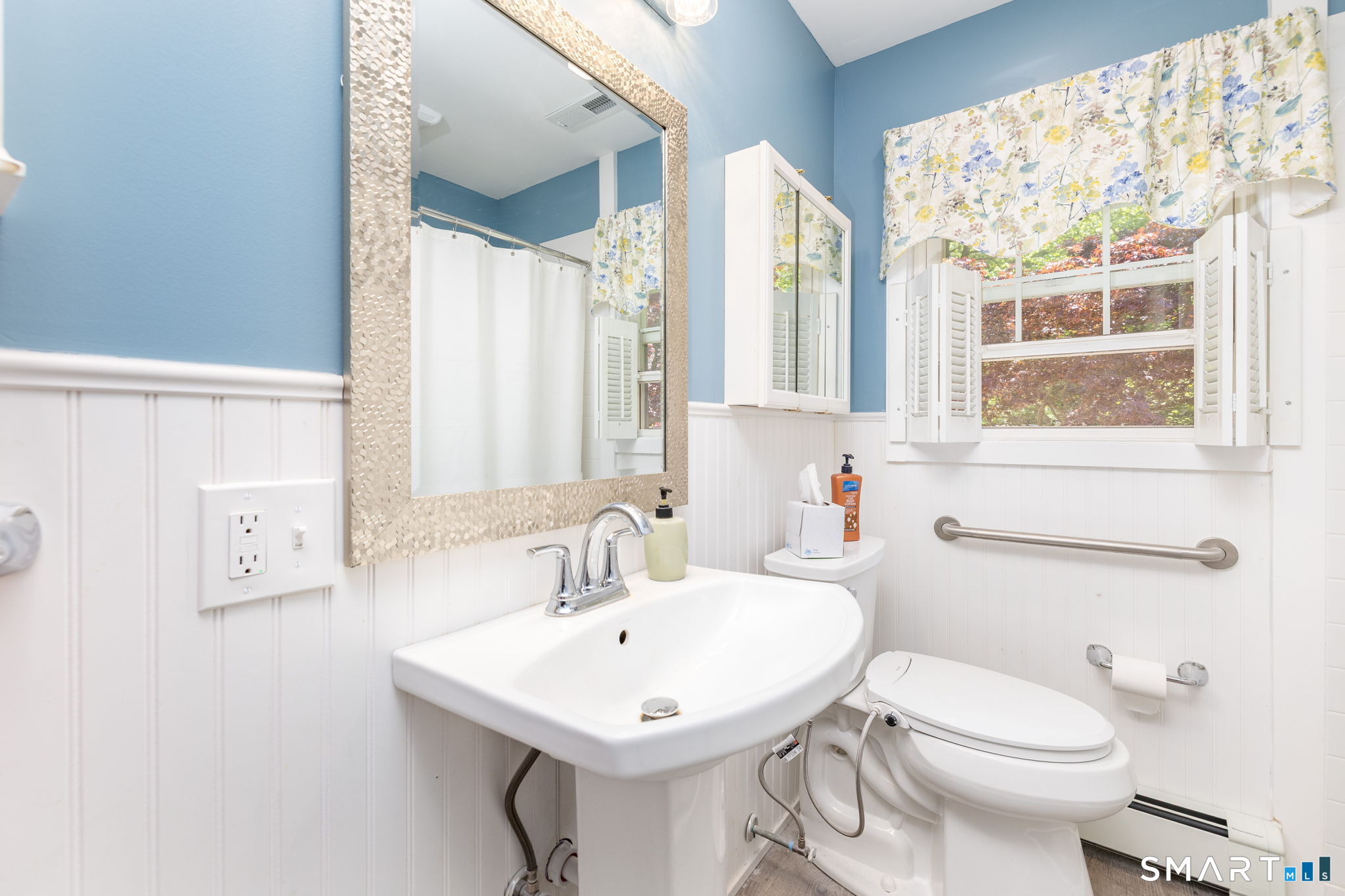 189 Bee Street Meriden, CT 06450 - Photo 16 of 39 a bathroom with a sink a toilet and a mirror