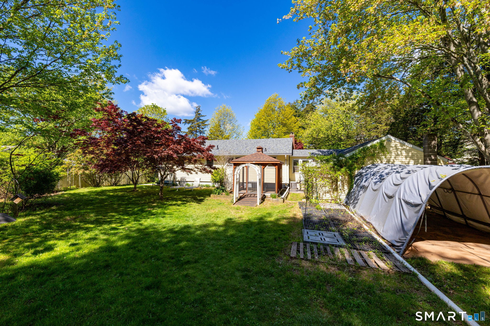 189 Bee Street Meriden, CT 06450 - Photo 26 of 39 a view of a garden with a house