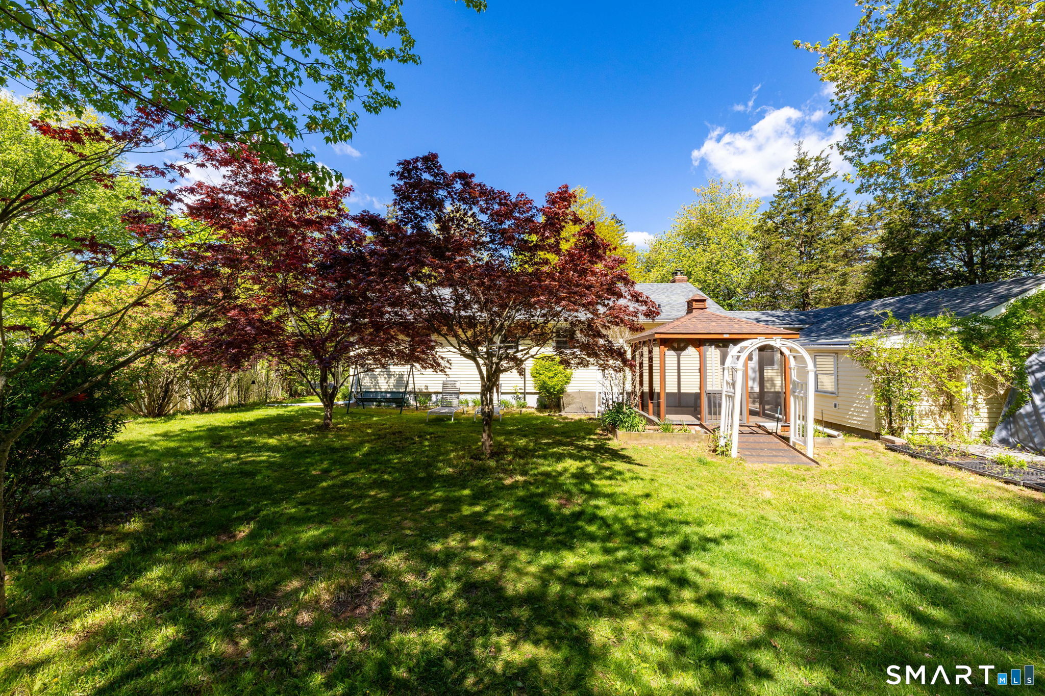 189 Bee Street Meriden, CT 06450 - Photo 29 of 39 a view of a yard with a house in the background