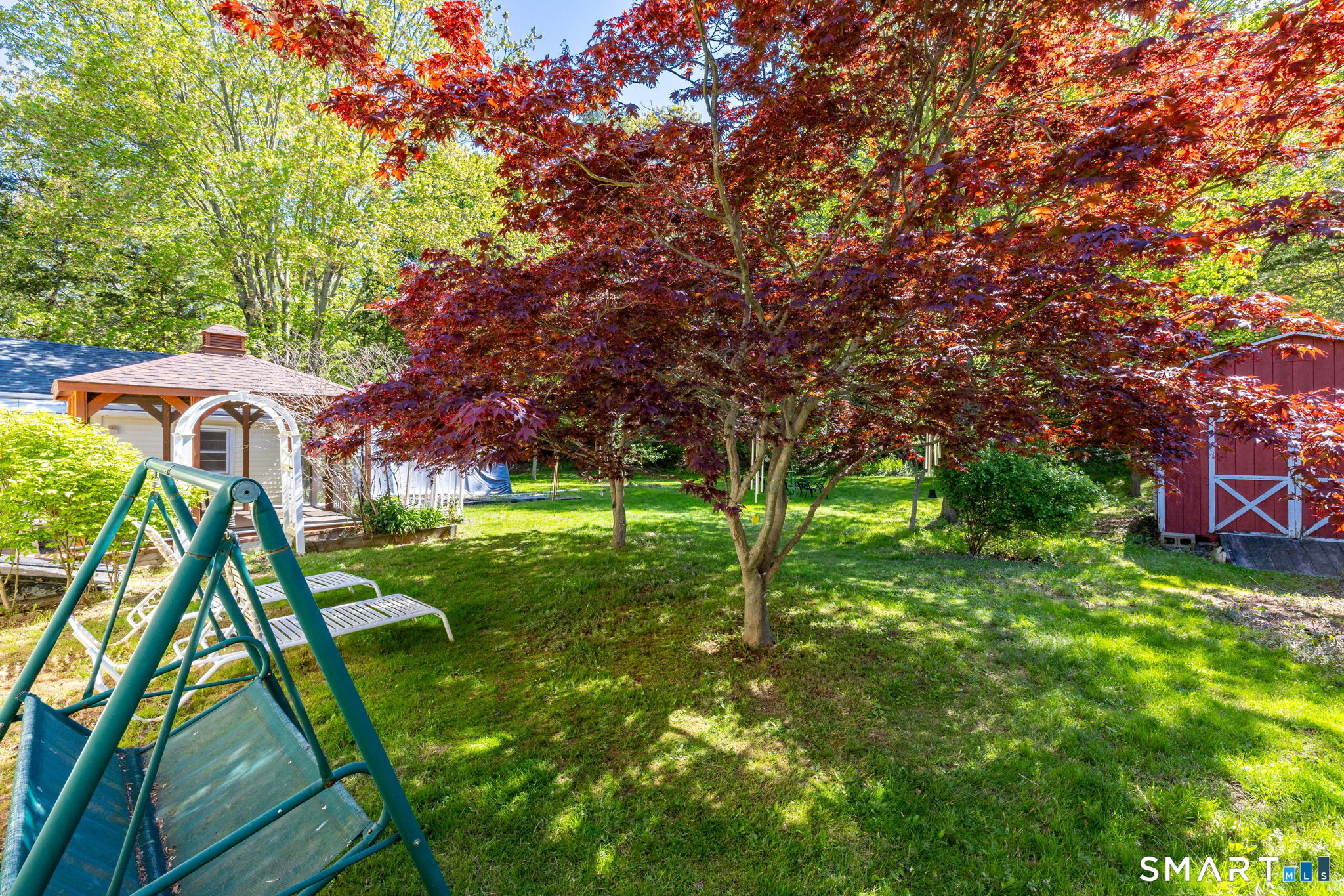 189 Bee Street Meriden, CT 06450 - Photo 37 of 39 a backyard of a house with table and chairs