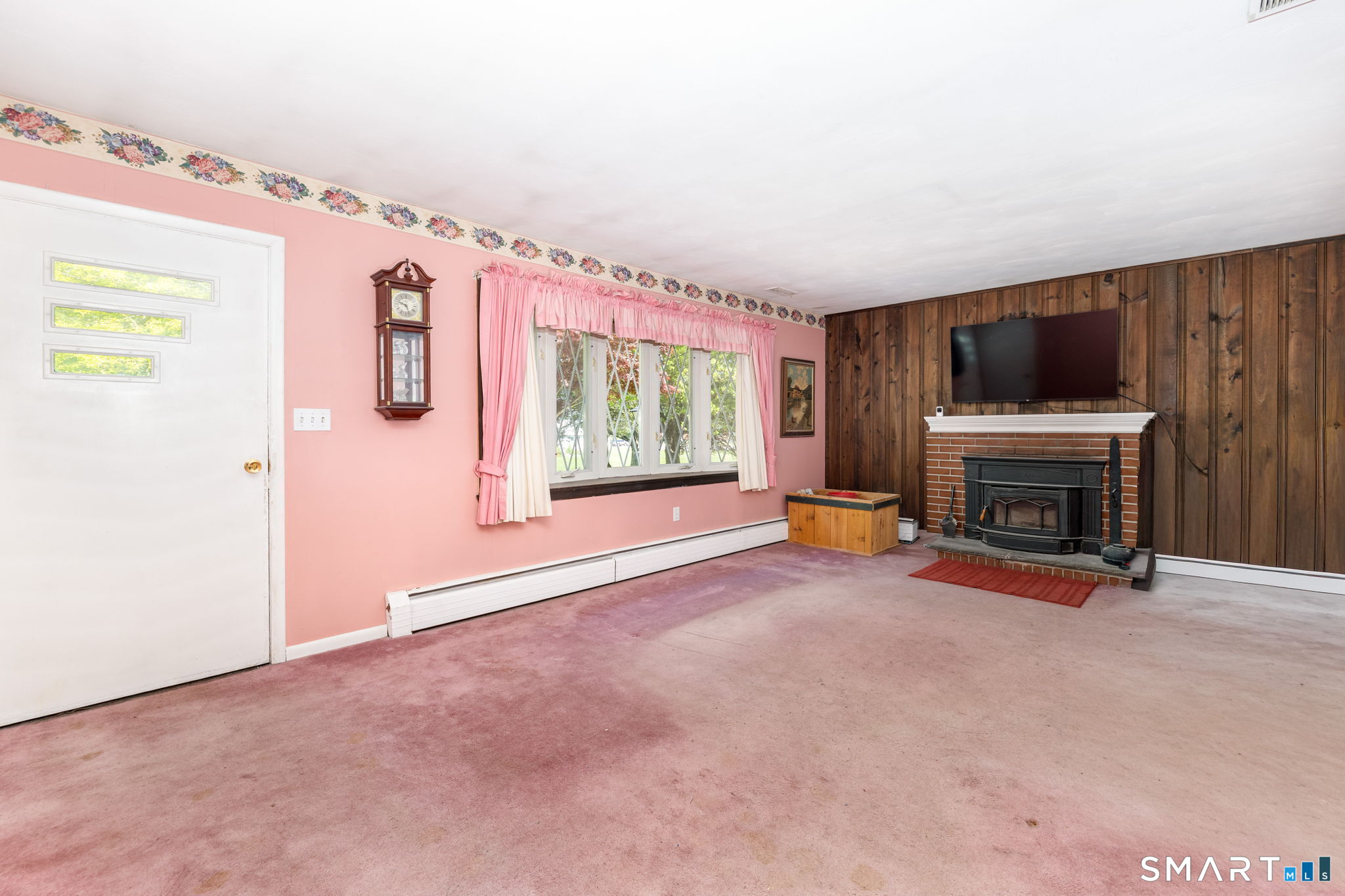 189 Bee Street Meriden, CT 06450 - Photo 7 of 39 a view of a livingroom with an empty space and a fireplace