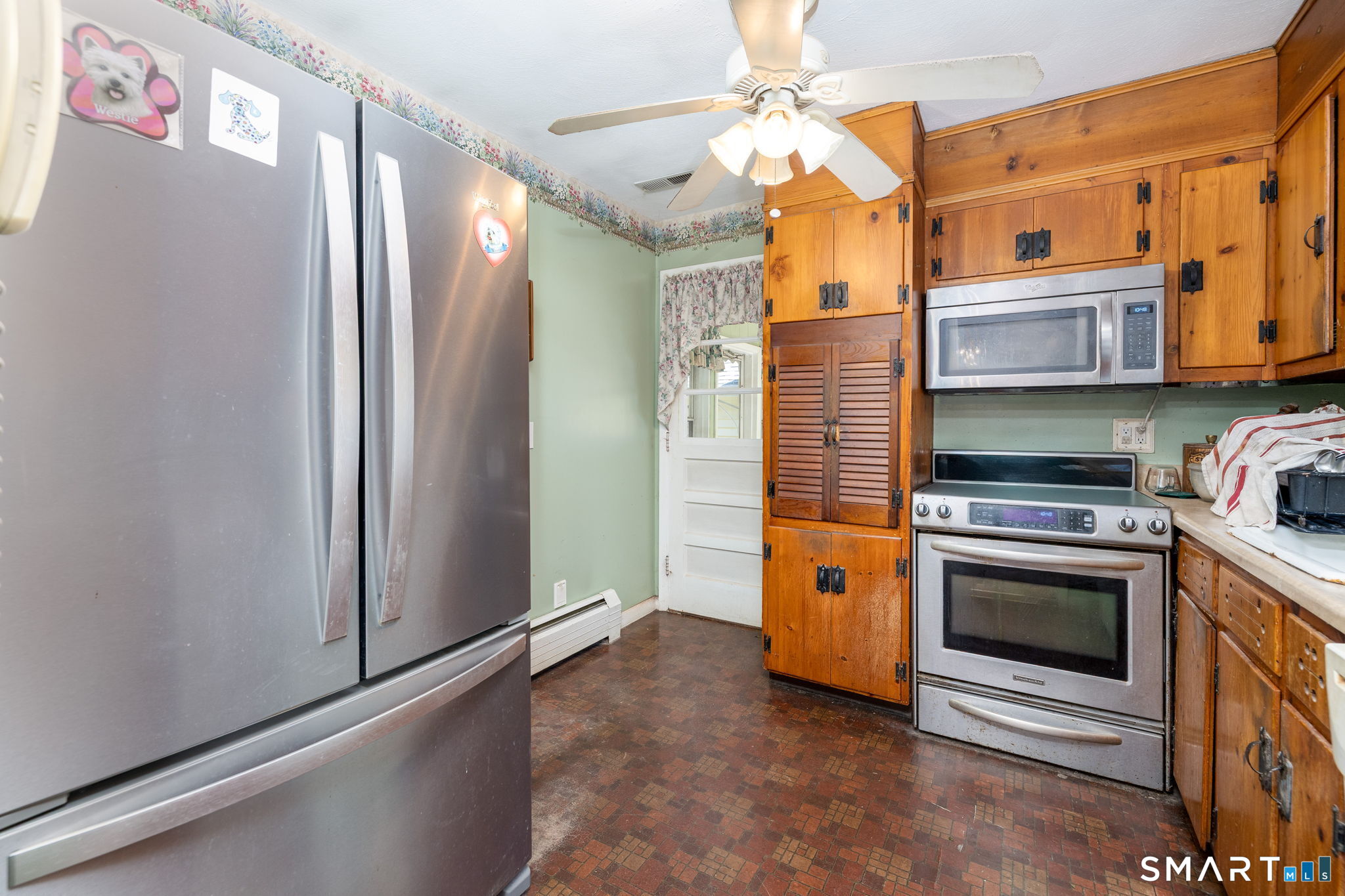 189 Bee Street Meriden, CT 06450 - Photo 10 of 39 a kitchen with stainless steel appliances granite countertop a stove a washer and dryer