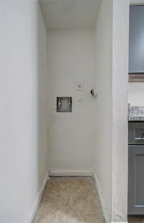 a view of a storage & utility room with a sink