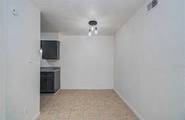 a view of a kitchen with a sink and a stove top oven