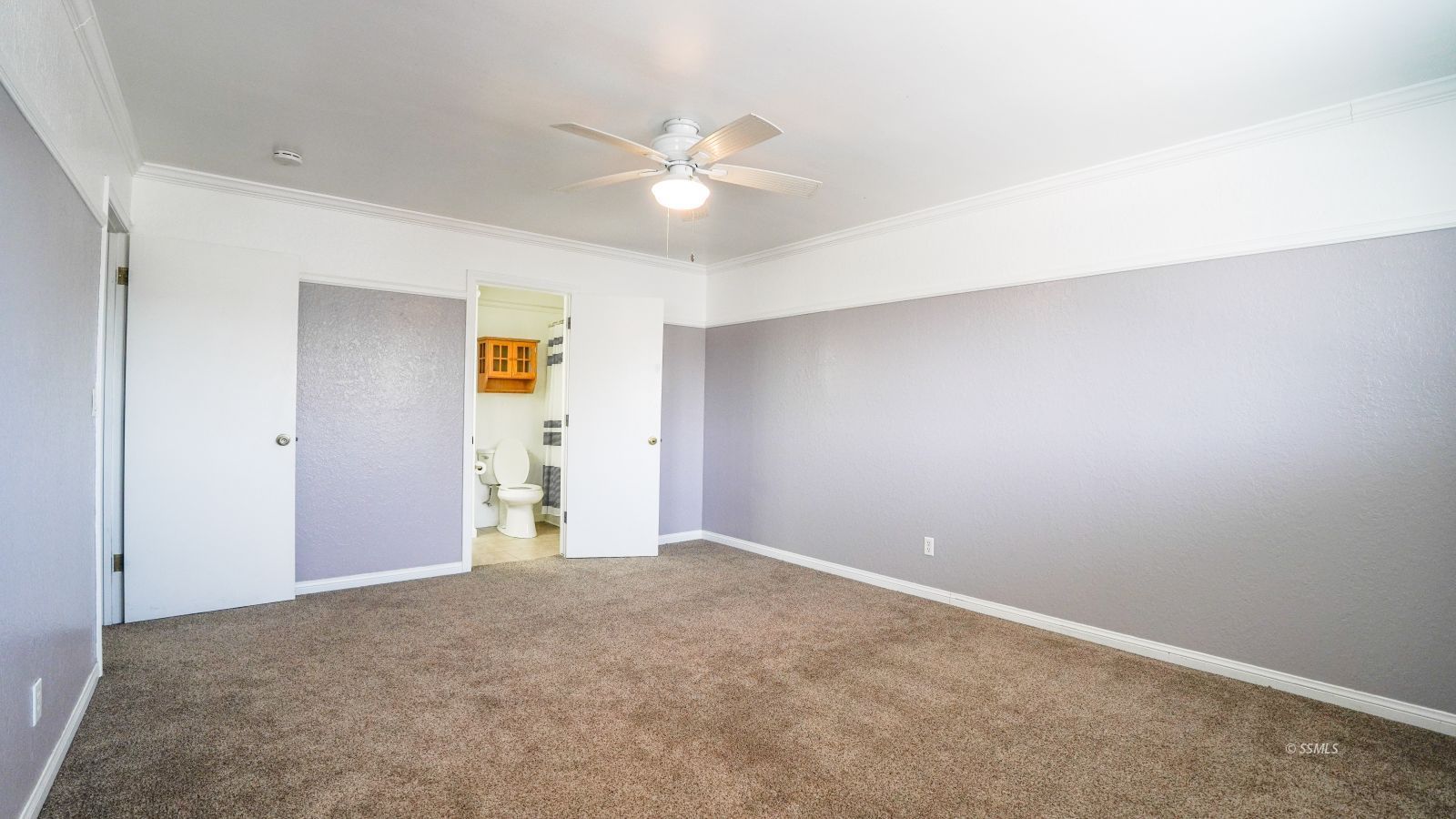 293 East Upjohn Avenue Ridgecrest, CA 93555 - Photo 13 of 21 an empty room with closet and fan