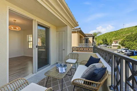 a view of a balcony and chairs