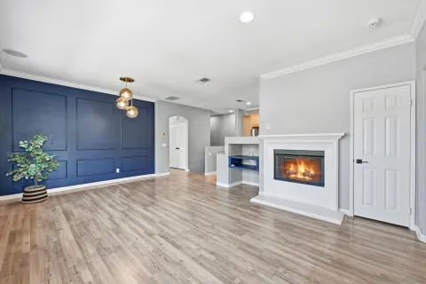 a view of an empty room and fire place