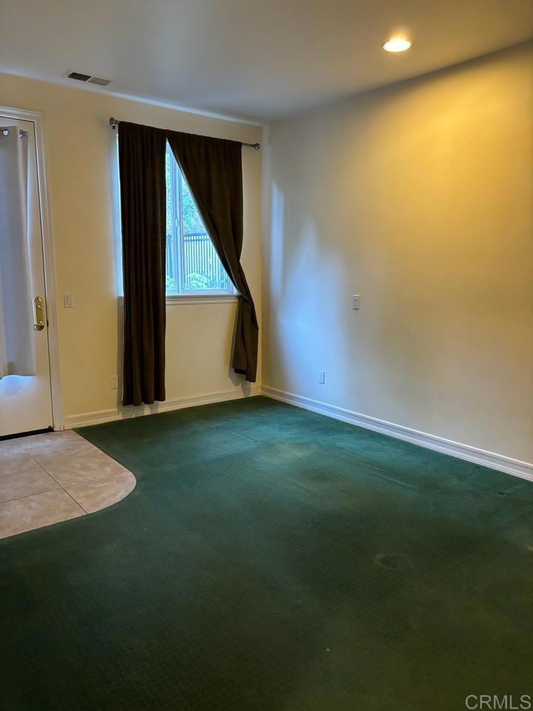 4415 Park Drive Carlsbad, CA 92008 - Photo 16 of 27 a view of an empty room with wooden floor and a window