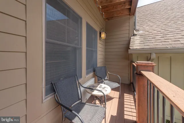 a bedroom with a bed and chair