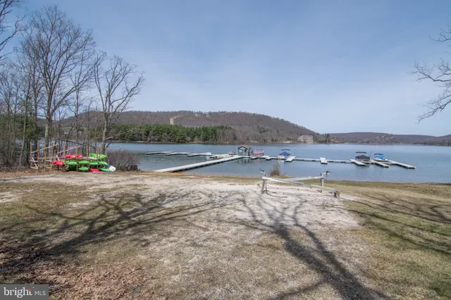 a view of a house with a yard and furniture