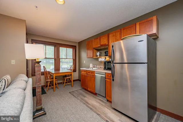 a living room with furniture and fireplace