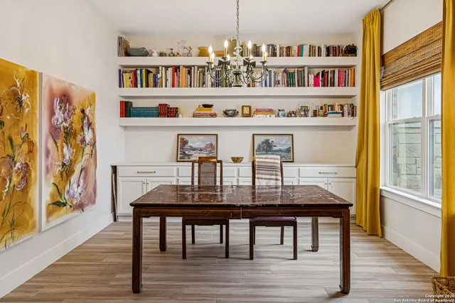 a view of a dining room with furniture and wooden floor