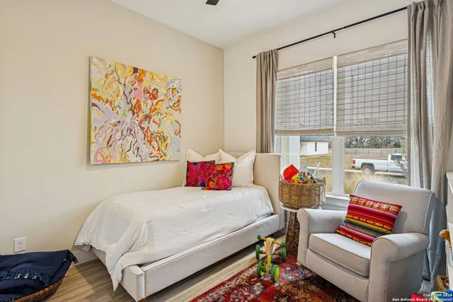 a bedroom with a bed and a couch