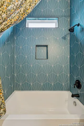 a bathroom with a bathtub