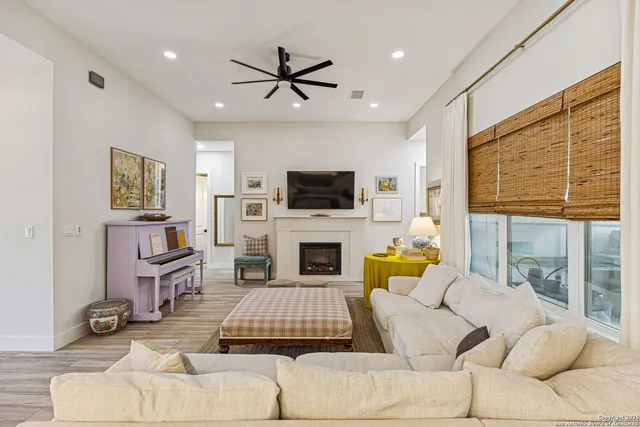 a living room with furniture and a fireplace