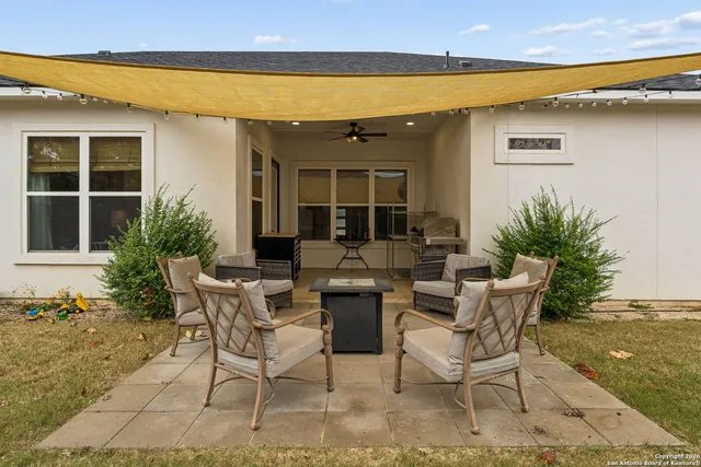 a view of a house with backyard porch and patio