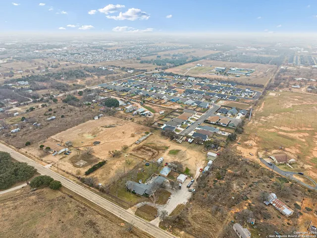 an aerial view of a house with a ocean view