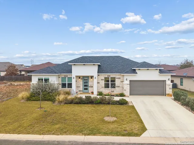a view of house with yard