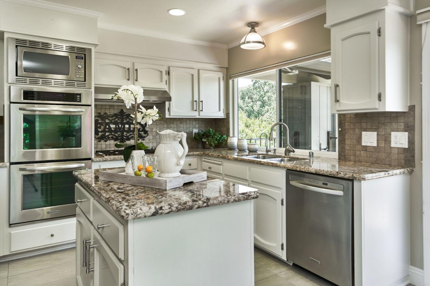 1264 Chateau Drive San Jose, CA 95120 - Photo 16 of 44 a kitchen with stainless steel appliances granite countertop a sink stove and refrigerator