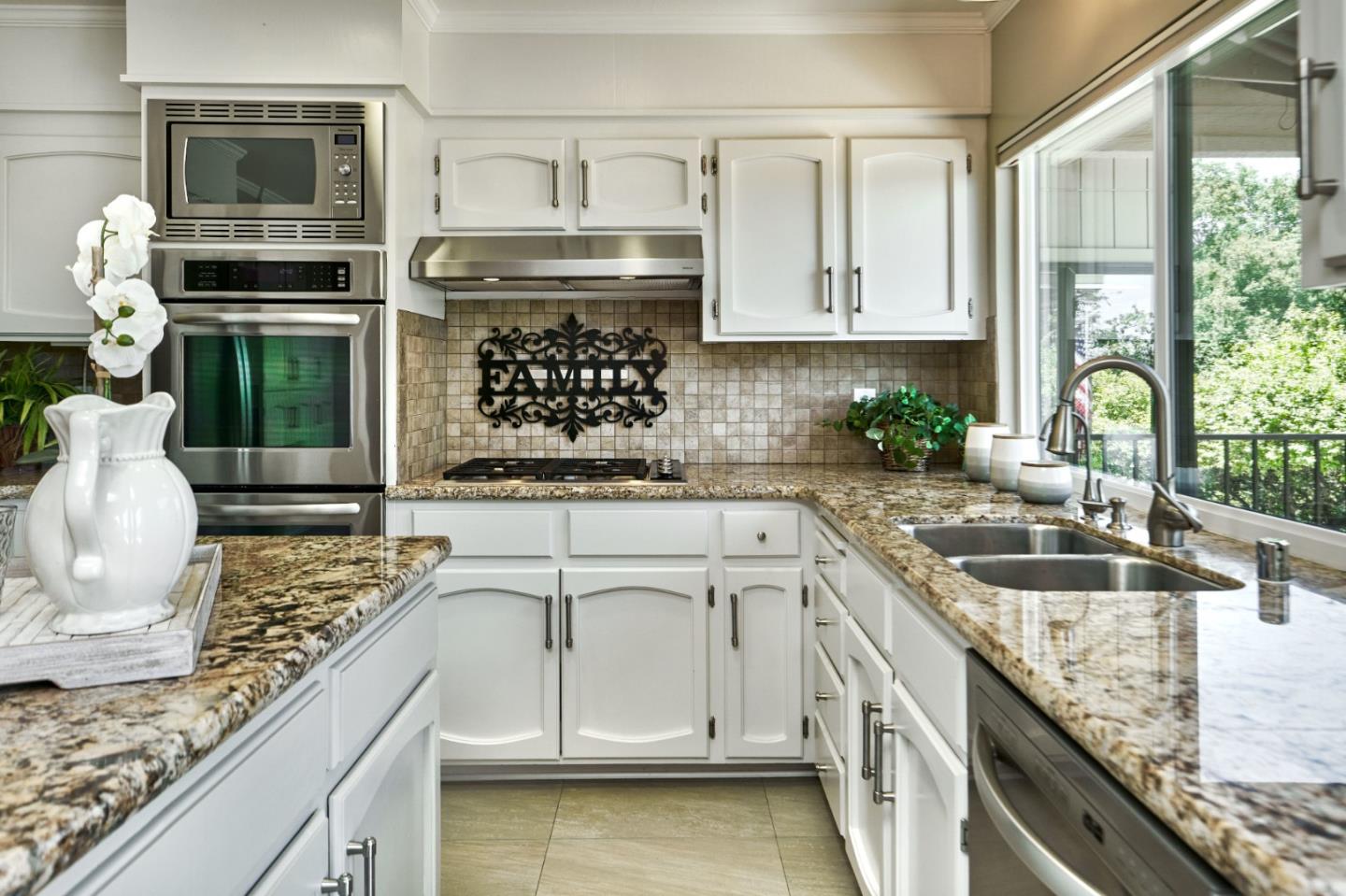 1264 Chateau Drive San Jose, CA 95120 - Photo 17 of 44 a kitchen with stainless steel appliances granite countertop a stove a sink and a microwave