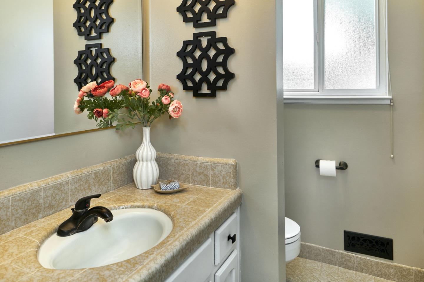 1264 Chateau Drive San Jose, CA 95120 - Photo 34 of 44 a bathroom with a sink a toilet and a mirror