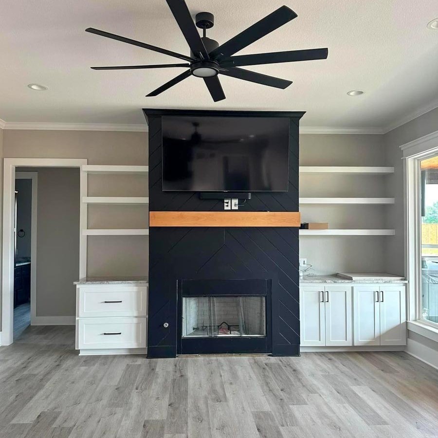4967 Ward Bend Road Sealy, TX 77474 - Photo 4 of 6 a view of an empty room with wooden floor and a cabinet