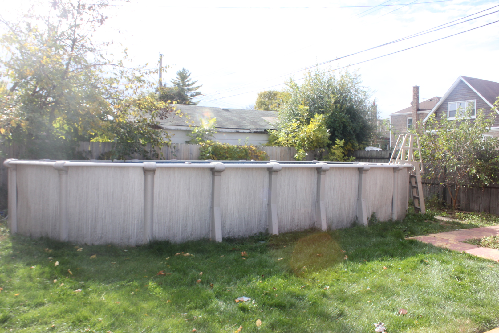 10200 South Rhodes Avenue Chicago, IL 60628 - Photo 17 of 22 a view of a backyard with wooden fence