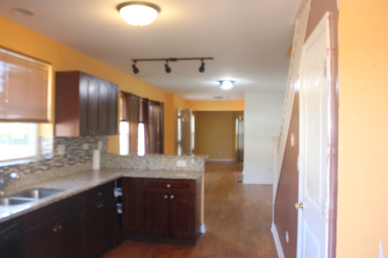 10200 South Rhodes Avenue Chicago, IL 60628 - Photo 6 of 22 a large bathroom with a granite countertop sink and a mirror