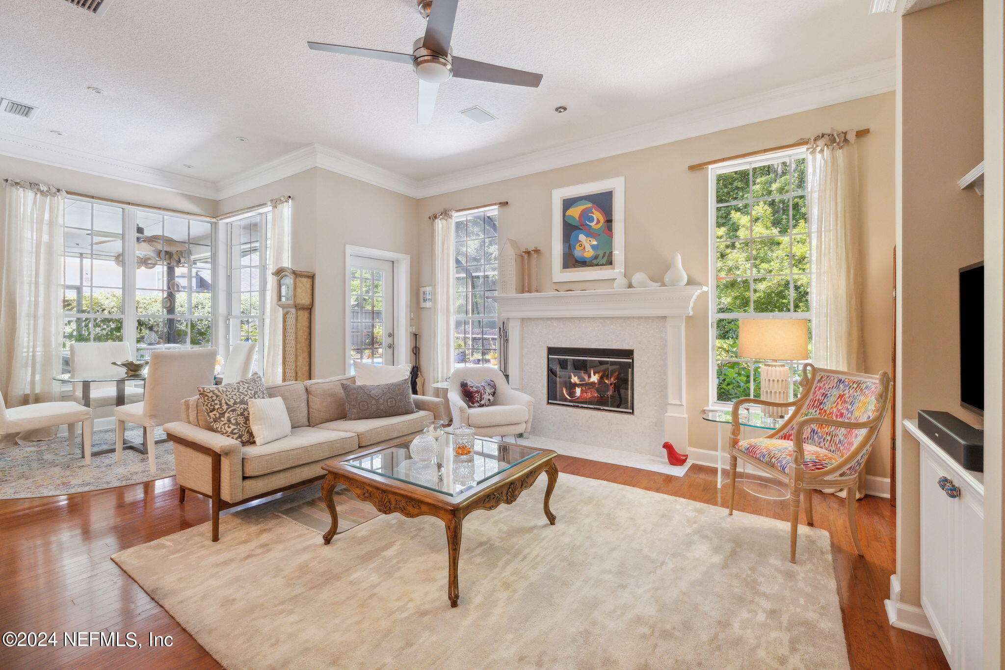 144 Bear Pen Road Ponte Vedra Beach, FL 32082 - Photo 22 of 74 a living room with furniture a rug and a fireplace