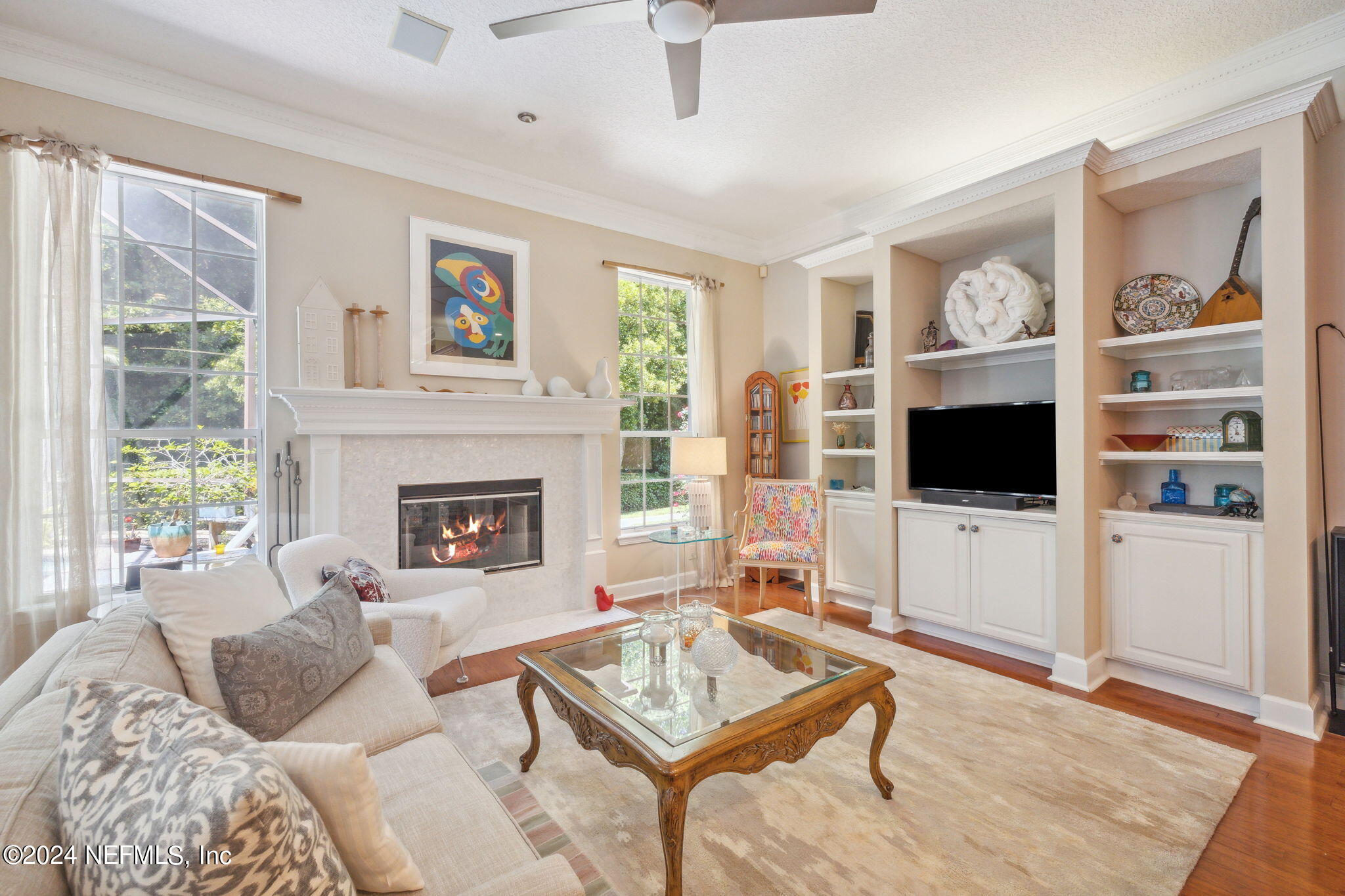 144 Bear Pen Road Ponte Vedra Beach, FL 32082 - Photo 23 of 74 a living room with furniture a flat screen tv and a fireplace