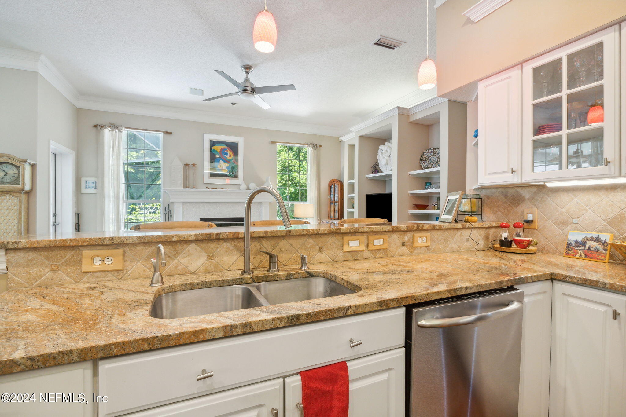 144 Bear Pen Road Ponte Vedra Beach, FL 32082 - Photo 27 of 74 a kitchen with granite countertop a sink and white cabinets