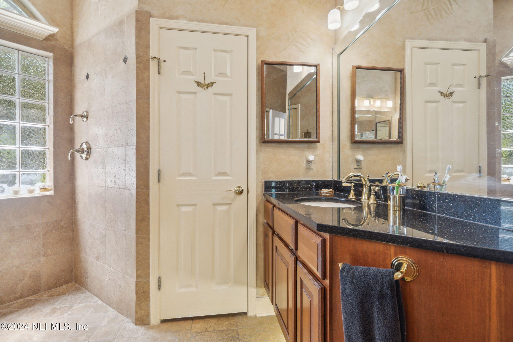 144 Bear Pen Road Ponte Vedra Beach, FL 32082 - Photo 34 of 74 a bathroom with a granite countertop sink and a mirror