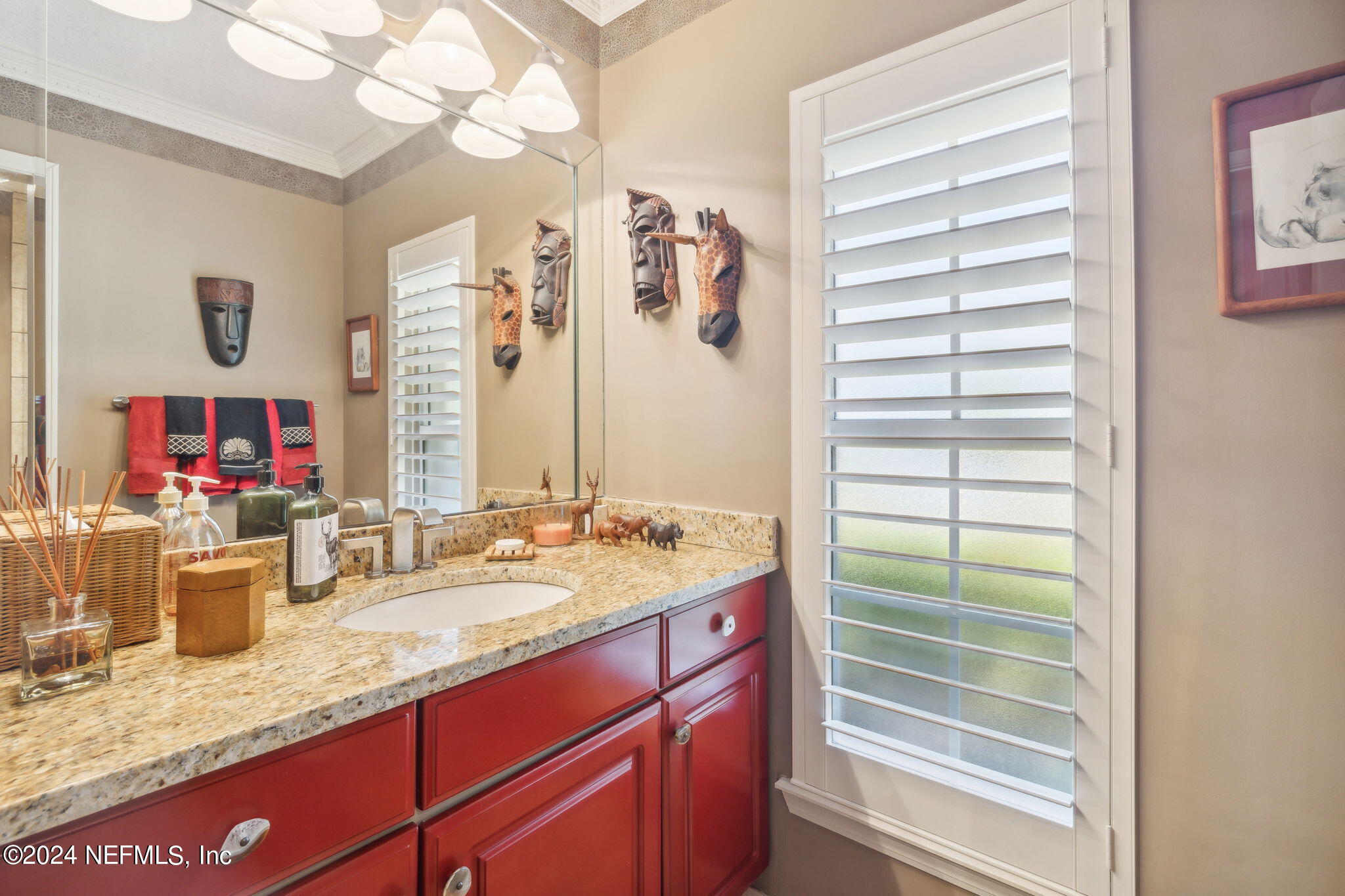144 Bear Pen Road Ponte Vedra Beach, FL 32082 - Photo 38 of 74 a bathroom with a granite countertop sink and a mirror