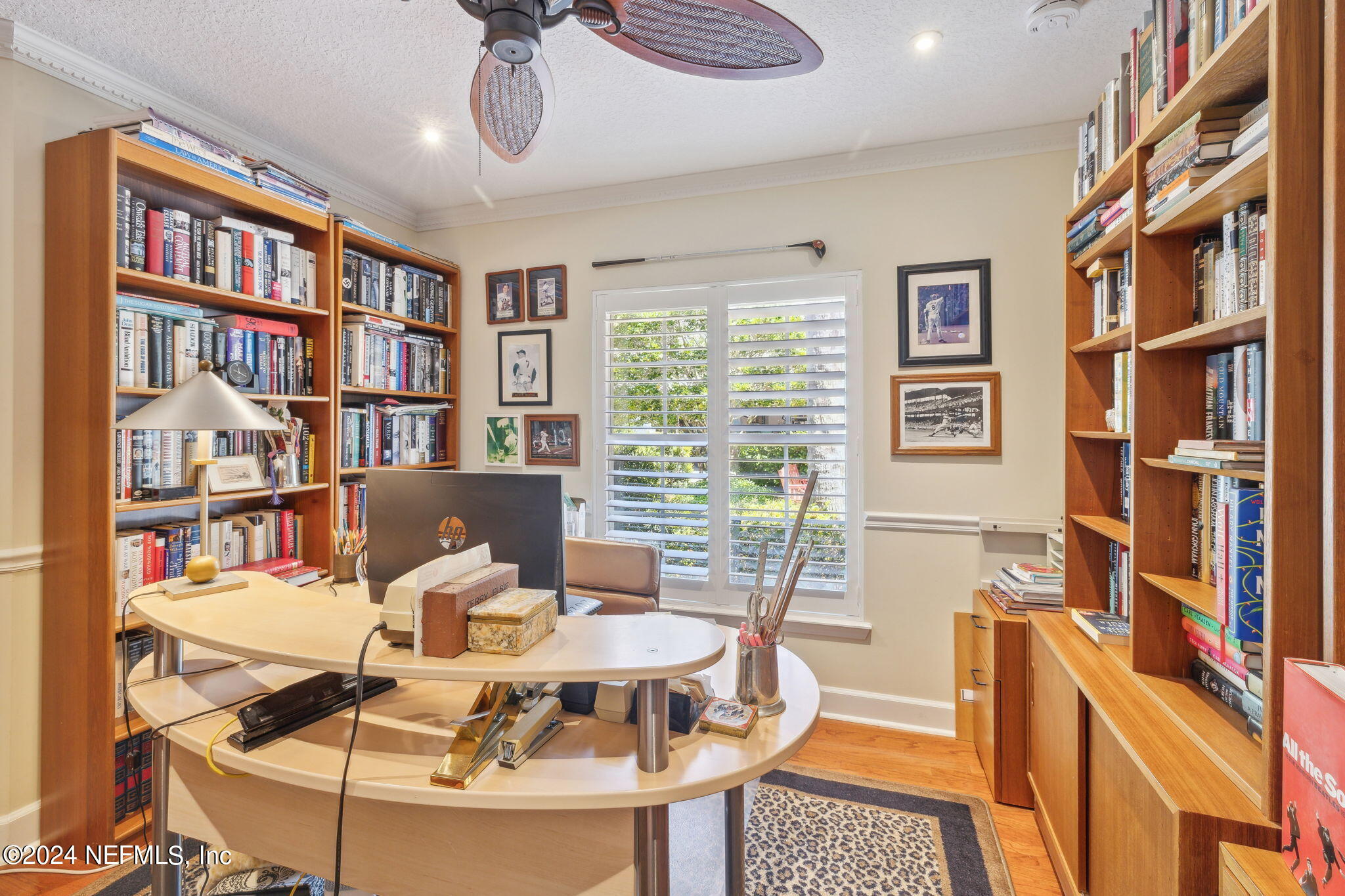 144 Bear Pen Road Ponte Vedra Beach, FL 32082 - Photo 40 of 74 a view of a livingroom with furniture and a bookshelf