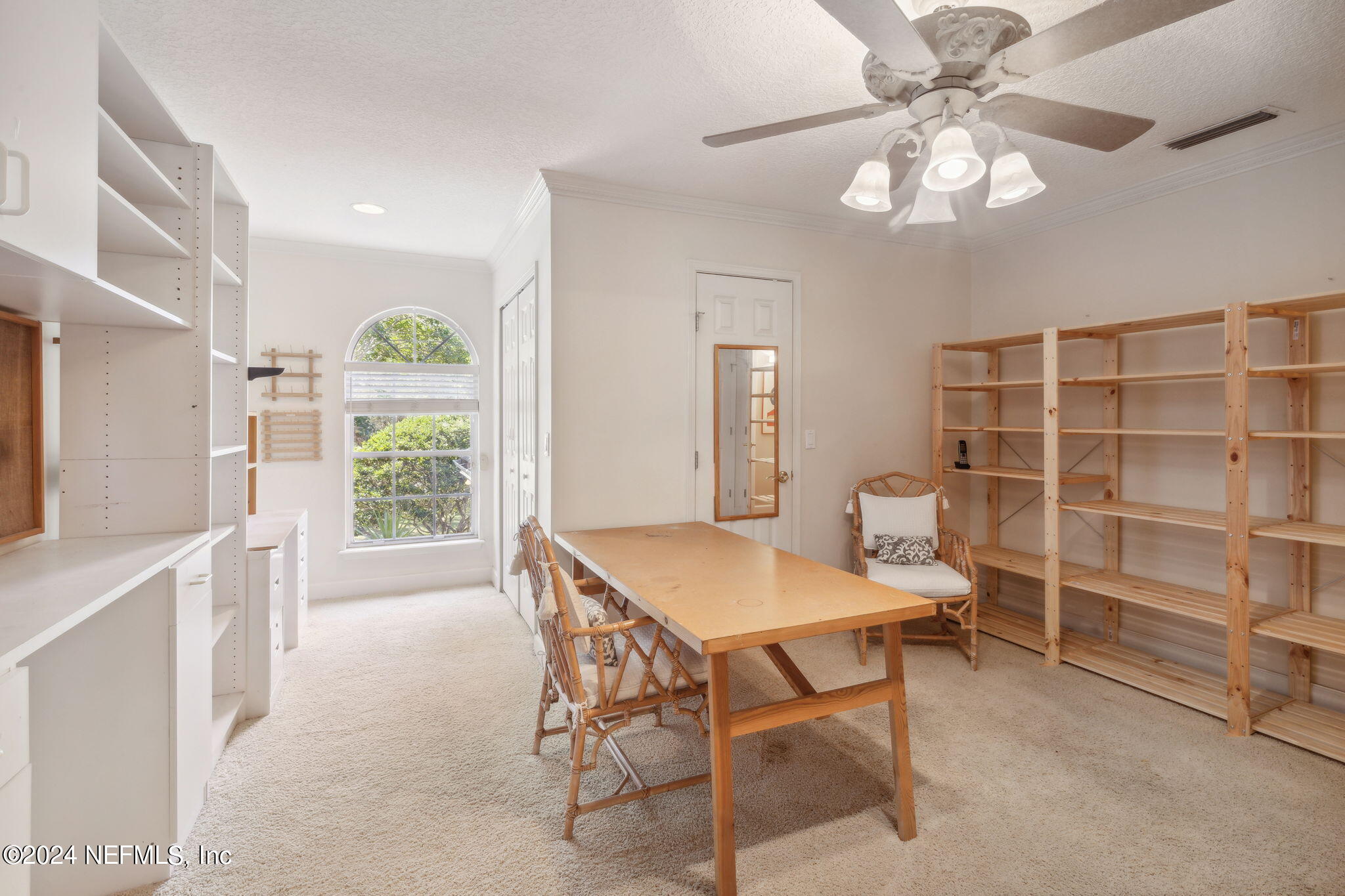 144 Bear Pen Road Ponte Vedra Beach, FL 32082 - Photo 41 of 74 a view of a dining room with furniture and a chandelier