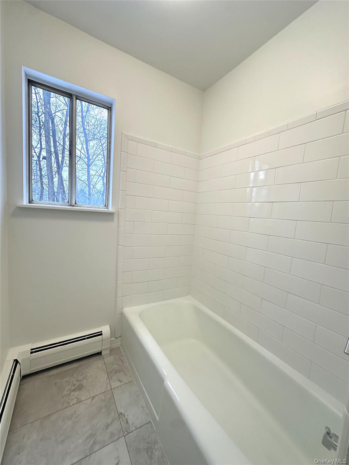 2740 South Road, Unit B7 Poughkeepsie, NY 12601 - Photo 14 of 16 Newly tiled tub area in main bath.