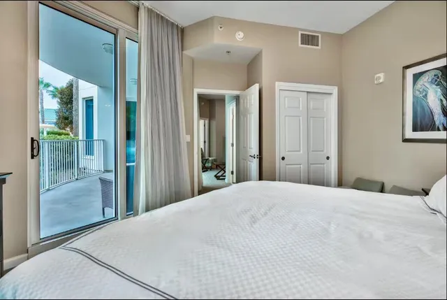 a large white bed in a white room