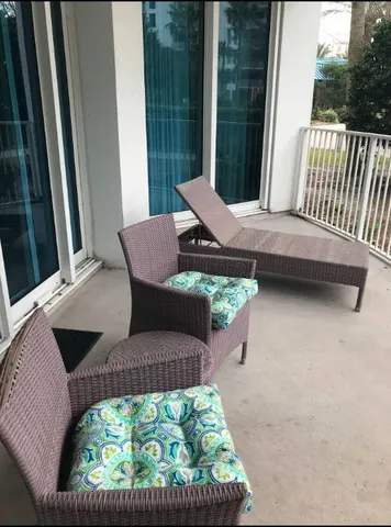 a view of balcony with a patio