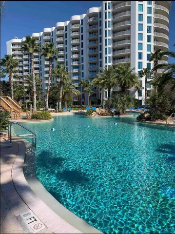 a view of a building and yard with green space
